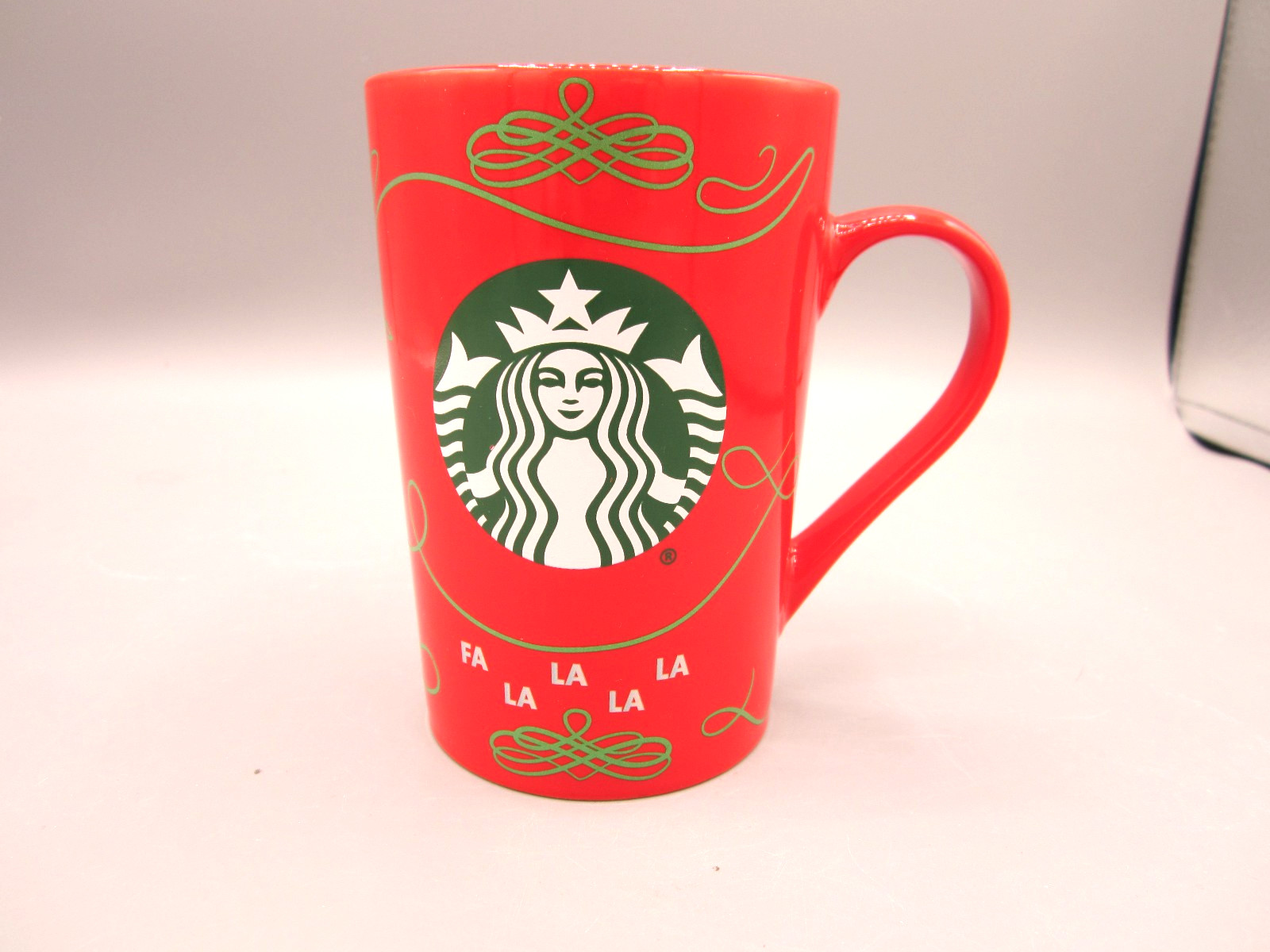Starbucks Christmas Red Fa La La La Green Siren Logo Coffee Tea Mug 11 oz (705) Starbucks Christmas Red Fa La La La Green Siren Logo Coffee Tea Mug 11 oz (705)