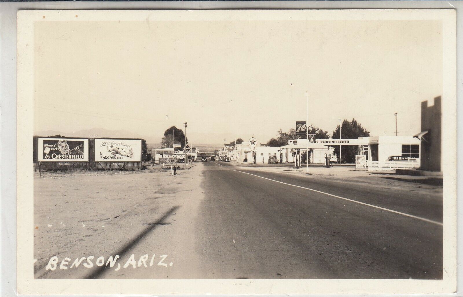 RPPC Benson, AZ Main Street vintage Postcard Chesterfield 76 Acme Beer Texaco