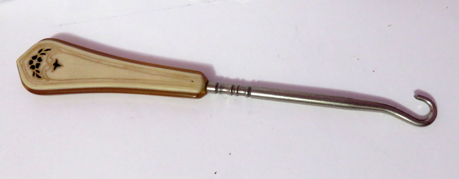 VINTAGE CELLULOID OR LUCITE BUTTON HOOK