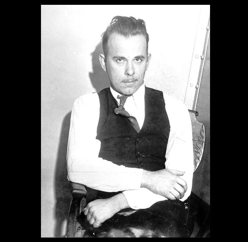 1934 John Dillinger PHOTO Gangster, Defiant Pose Seated, Great Depression Era