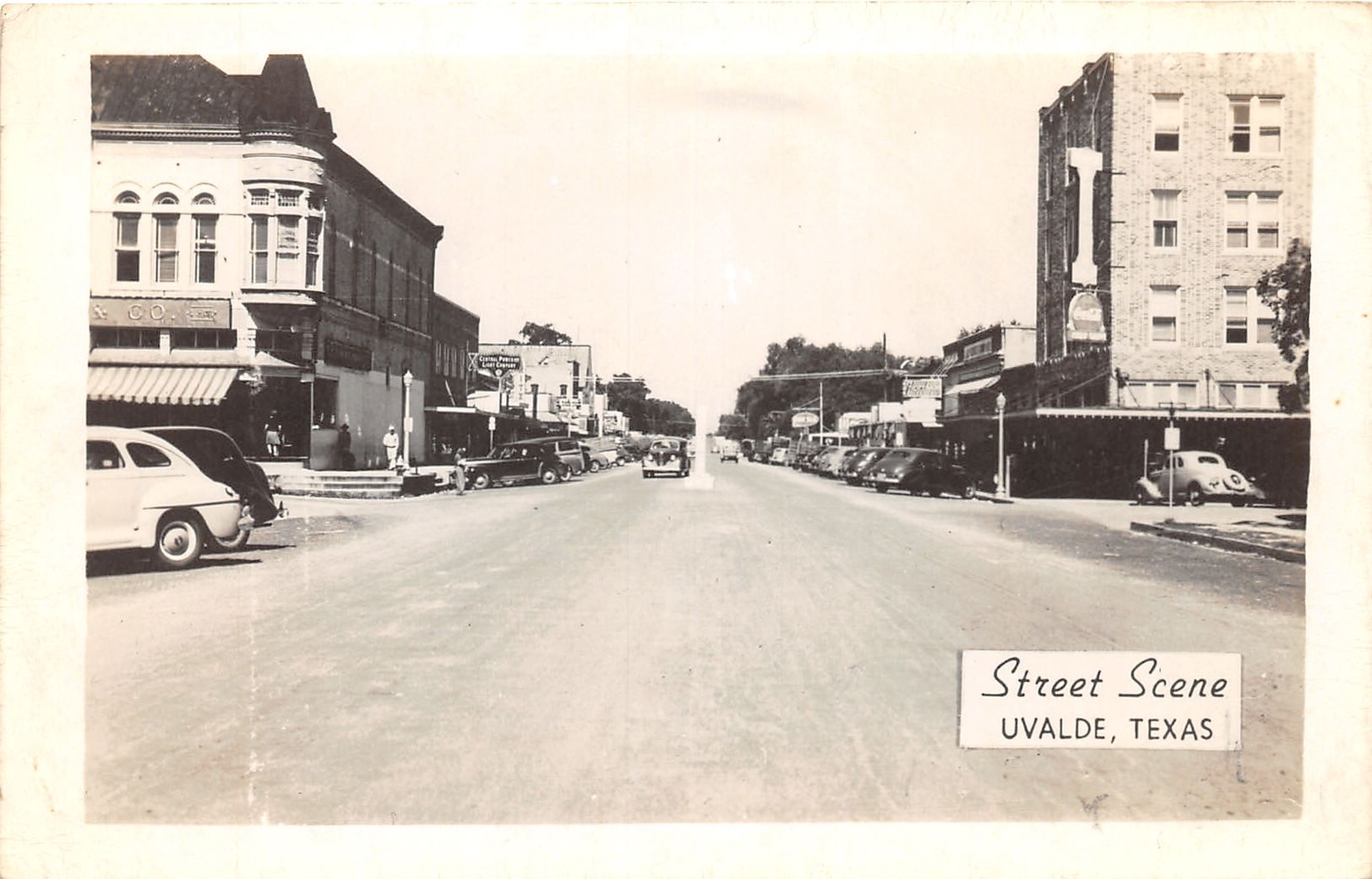 J38/ Uvalde Texas Postcard c1940s RPPC Street Scene Autos Stores 100