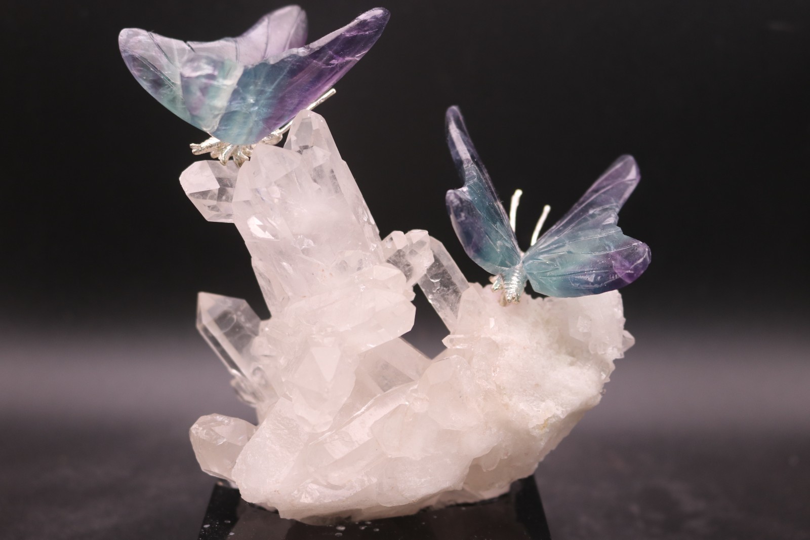 Peter Muller Hand Carved Fluorite Butterfly Pair on Quartz Base Peter Muller Hand Carved Fluorite Butterfly Pair on Quartz Base
