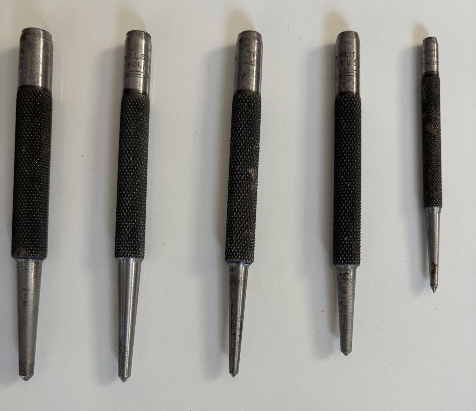 5 Starrett Center punchers, One Money, 