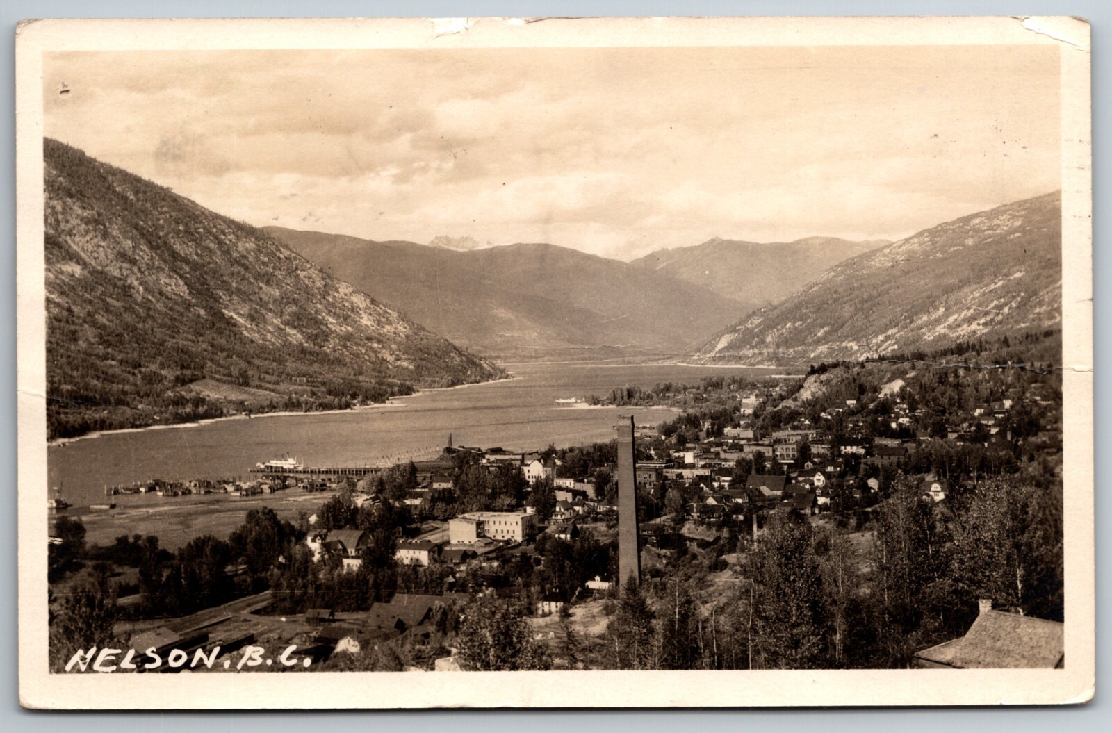 Nelson BC British Columbia Canada Birds Eye View of Town Bent Card RPPC Postcard Nelson BC British Columbia Canada Birds Eye View of Town Bent Card RPPC Postcard