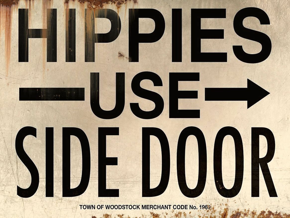HIPPIES USE SIDE DOOR TOWN WOODSTOCK HEAVY DUTY USA MADE METAL ADVERTISING SIGN