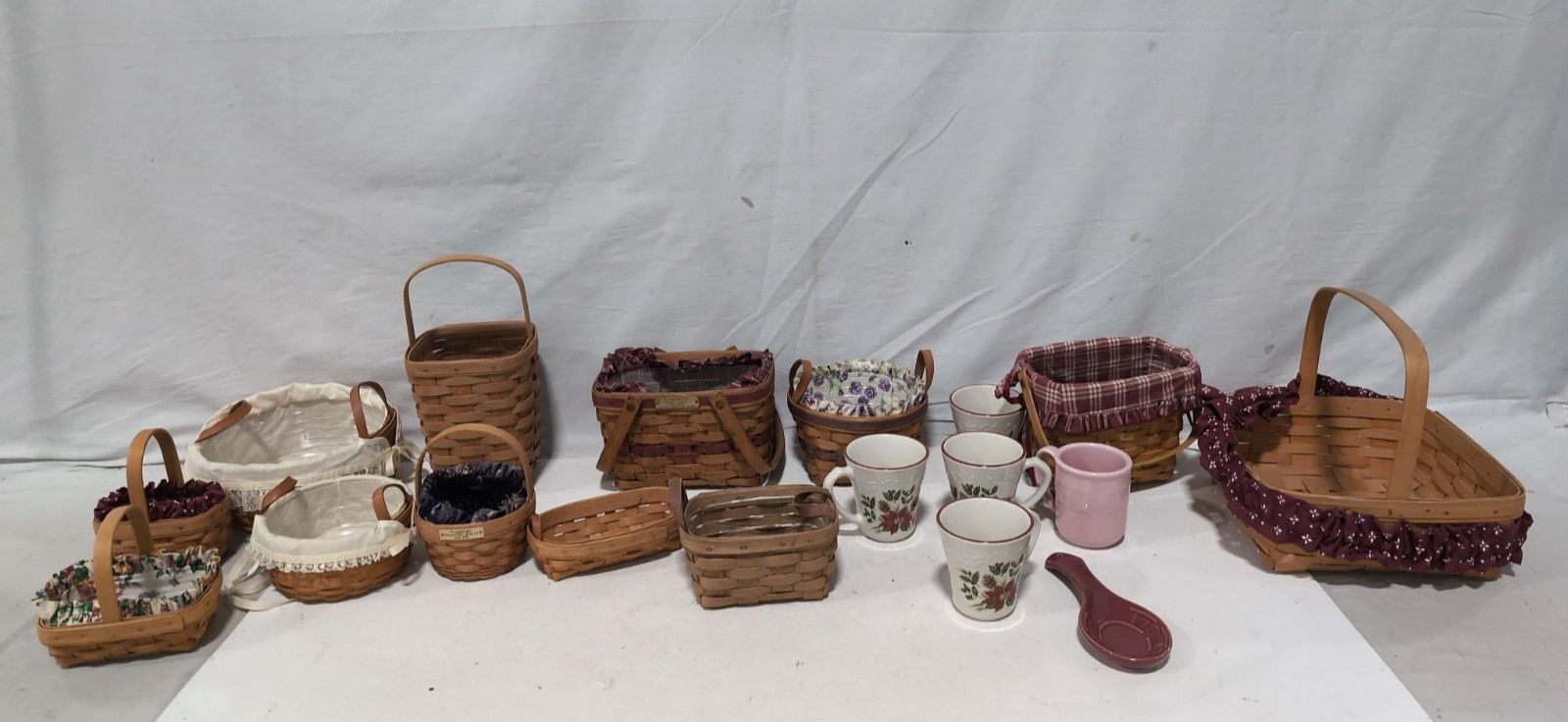 Lot of Longaberger Handwoven Baskets and Ceramic Mugs Assortment Lot of Longaberger Handwoven Baskets and Ceramic Mugs Assortment