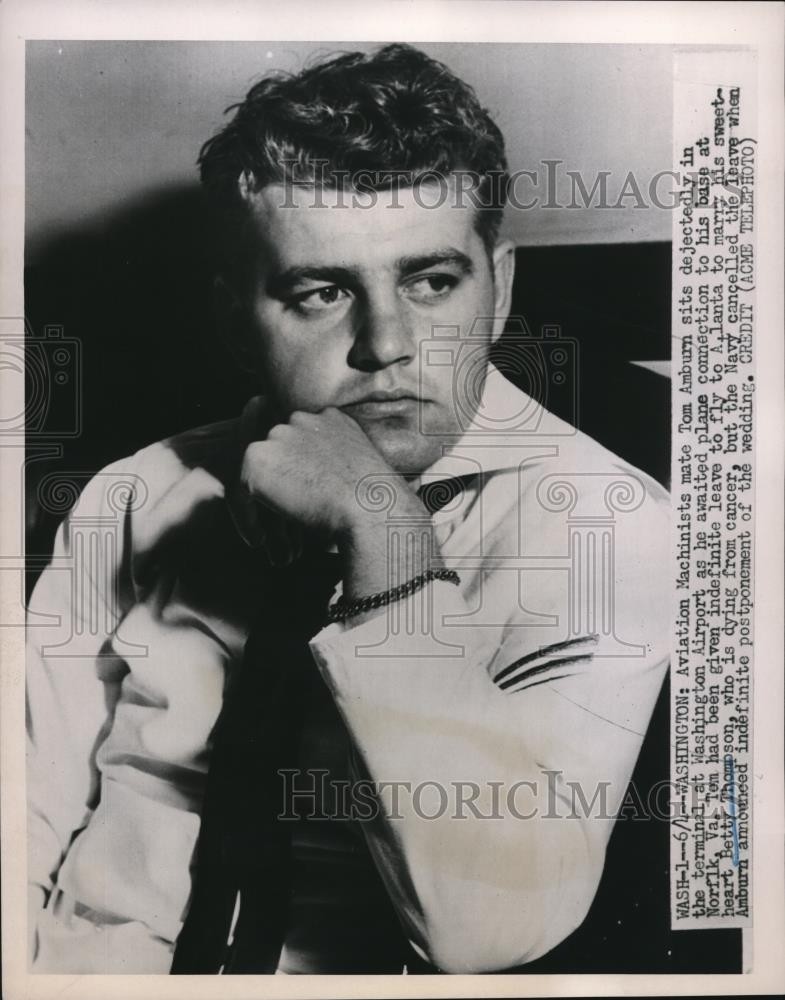 1951 Press Photo Aviation Machinist mate Tom Amburn seen waiting for his flight