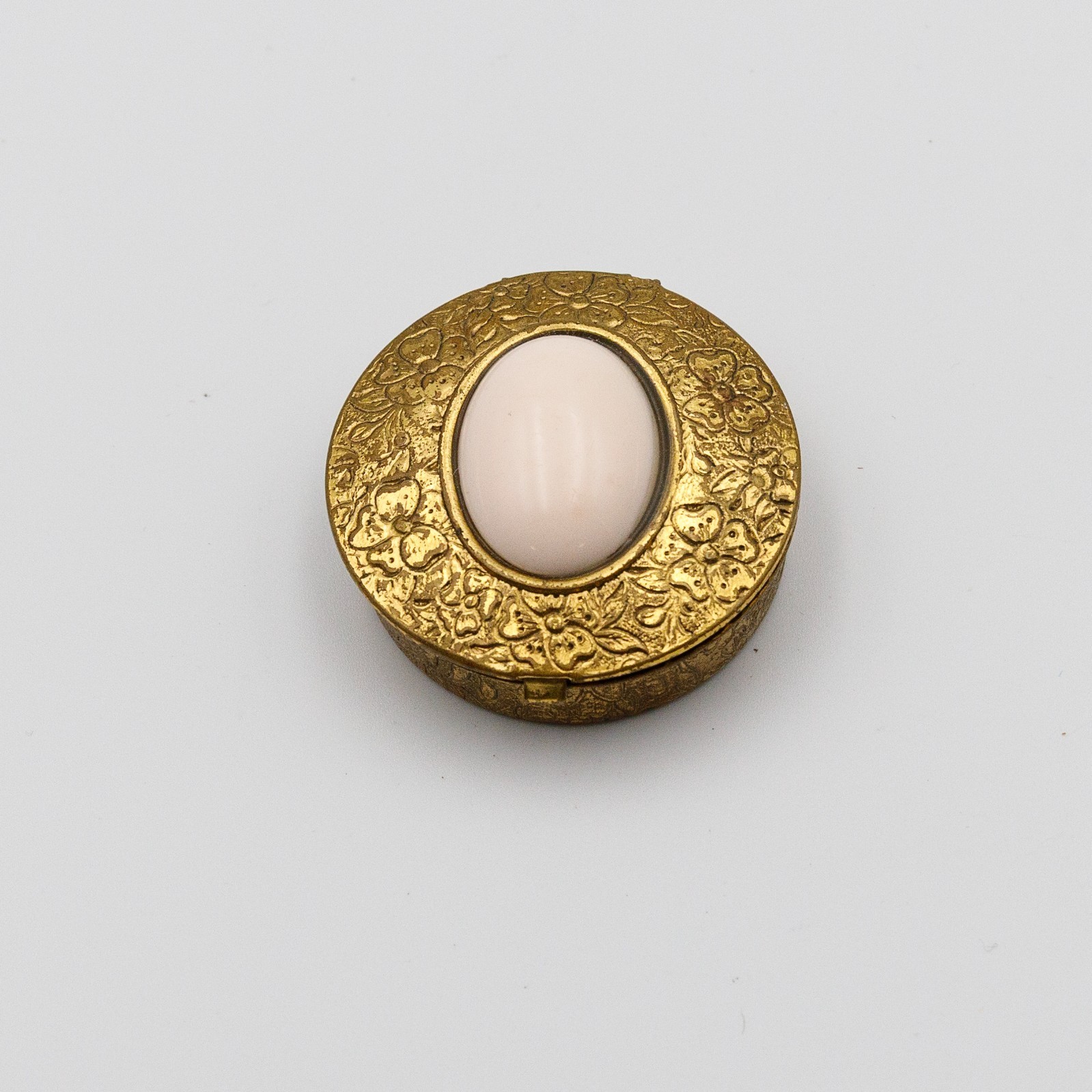 Vintage 1960s Era Gold Tone Floral Embossed Pill Trinket Box Pink Cabochon