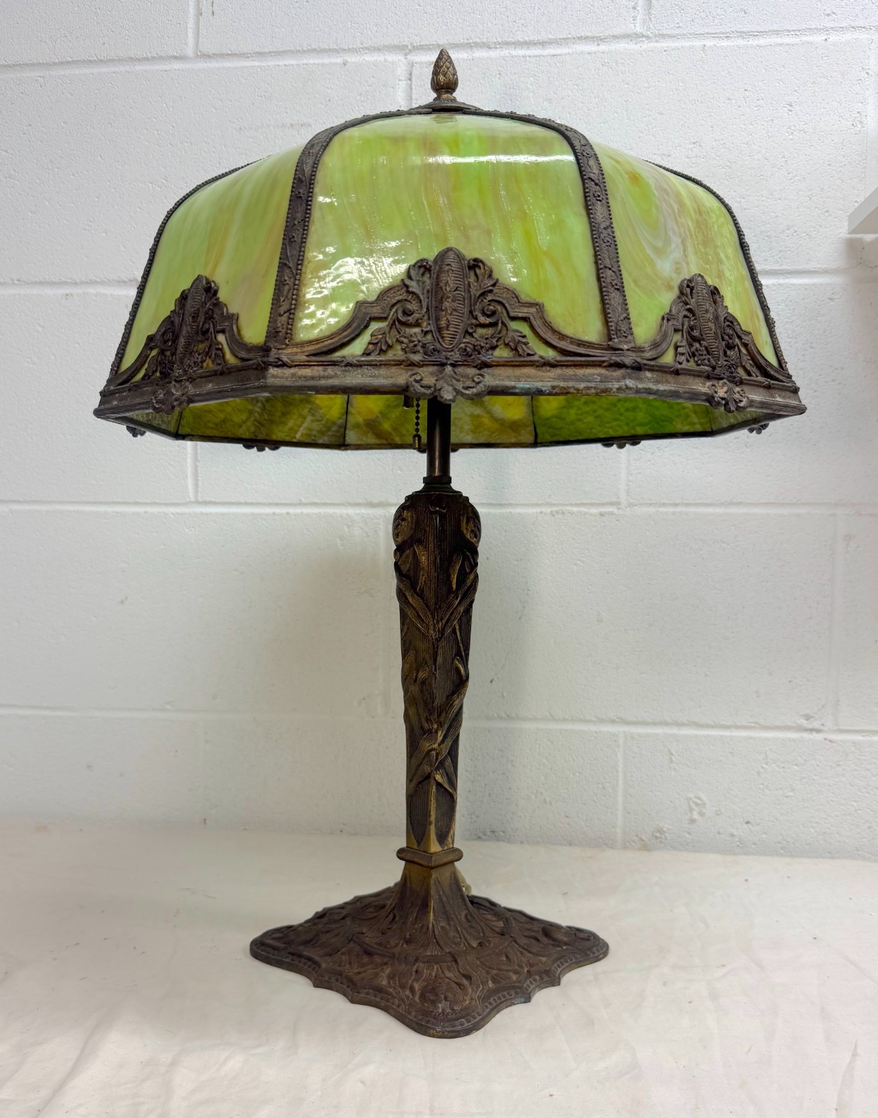 Antique bronze patinated cast iron green slag stained glass electric table lamp Antique bronze patinated cast iron green slag stained glass electric table lamp