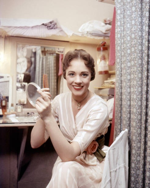 English actress Julie Andrews holding a hand mirror a comb a dress- Old Photo