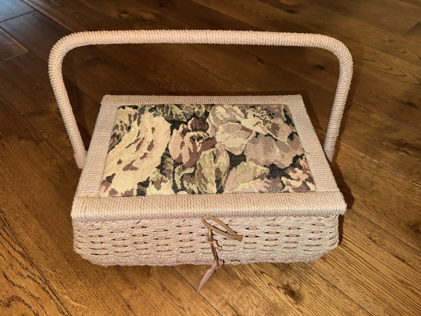 vintage Azar sewing basket woven exterior and lid with floral tapestry cushion.