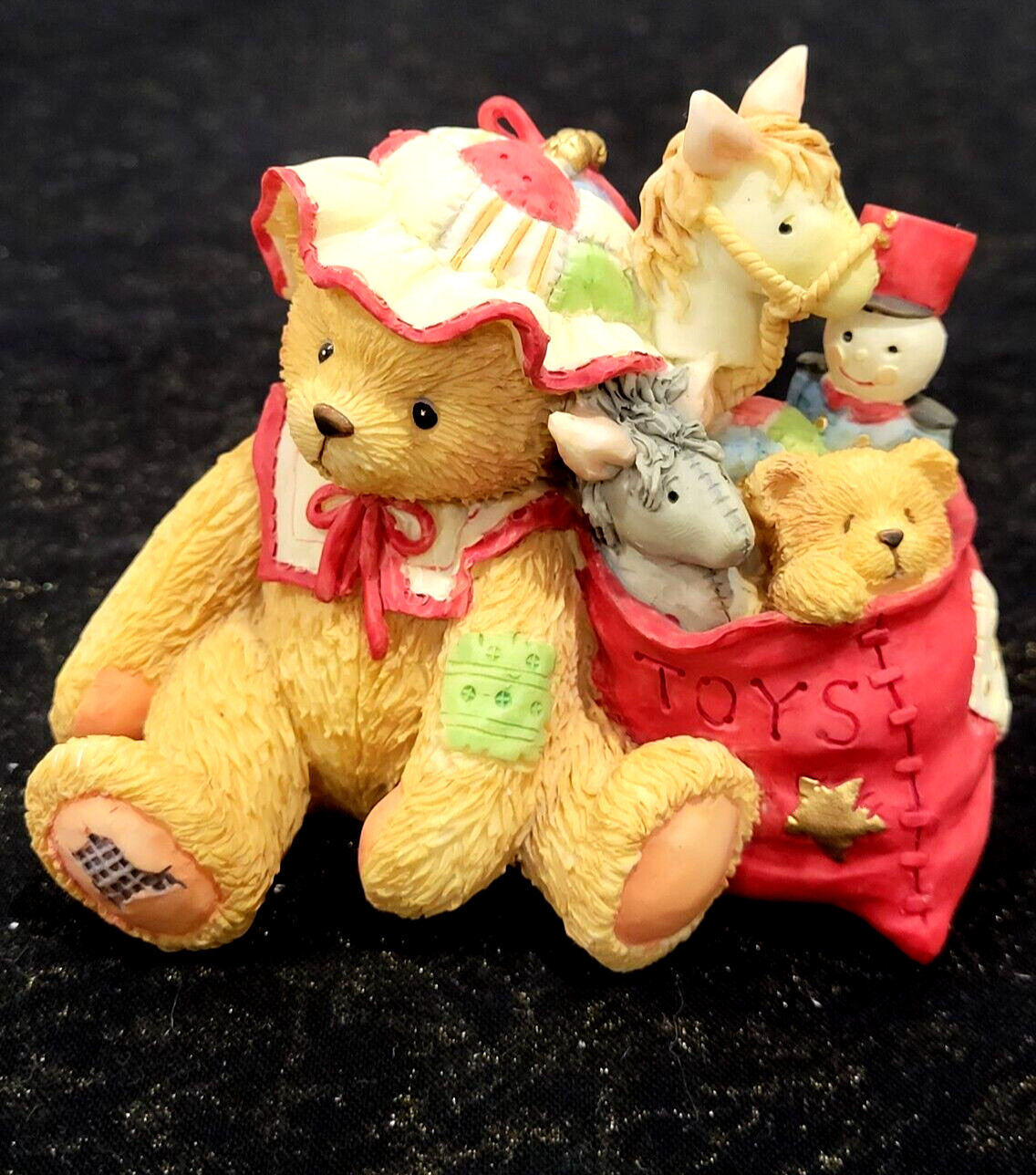 ENESCO Cherished Teddies Enesco. CAROLYN w/toy bag figurine. 1993. ENESCO Cherished Teddies Enesco. CAROLYN w/toy bag figurine. 1993.