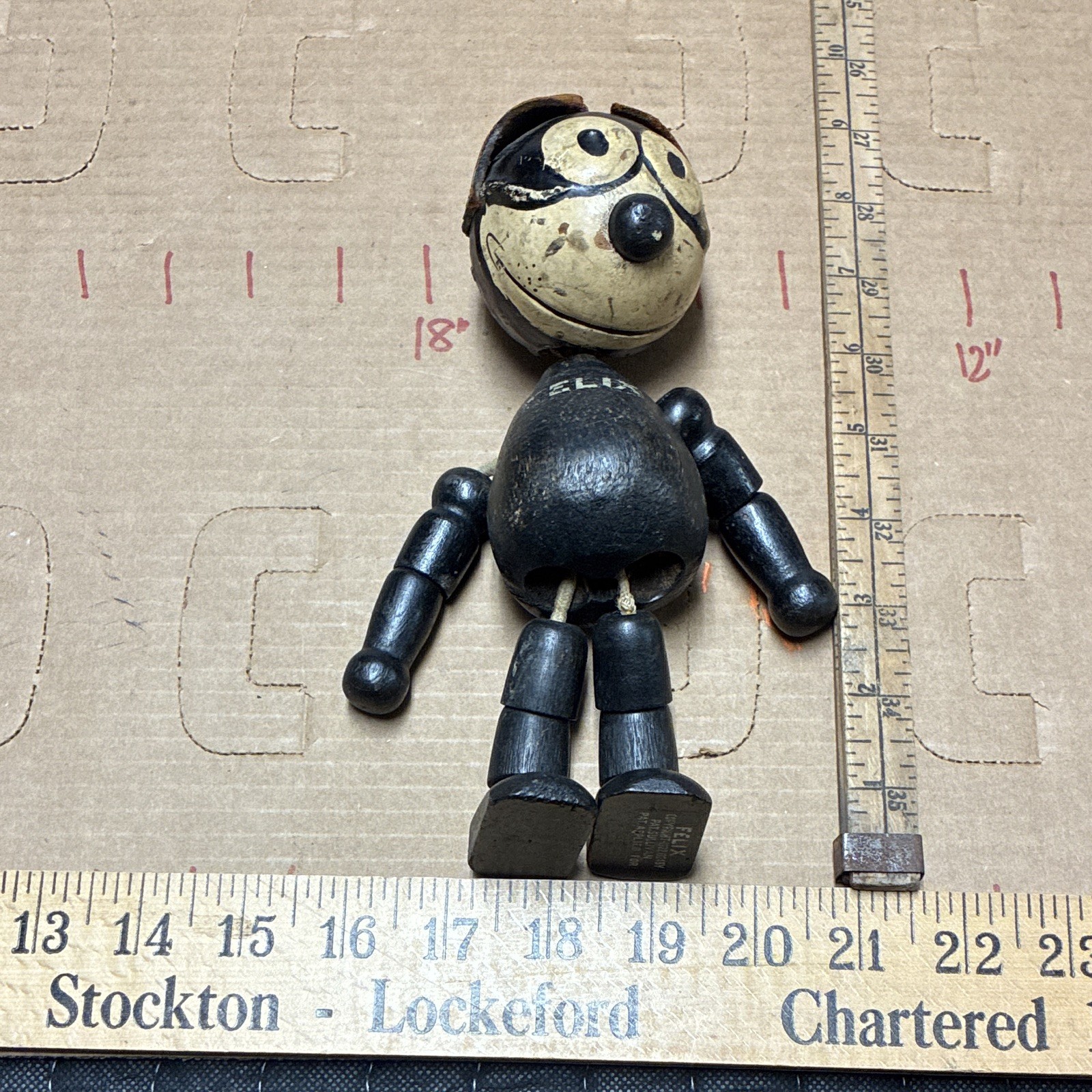 This is an antique, jointed wooden and composition Felix the Cat toy, 1920s