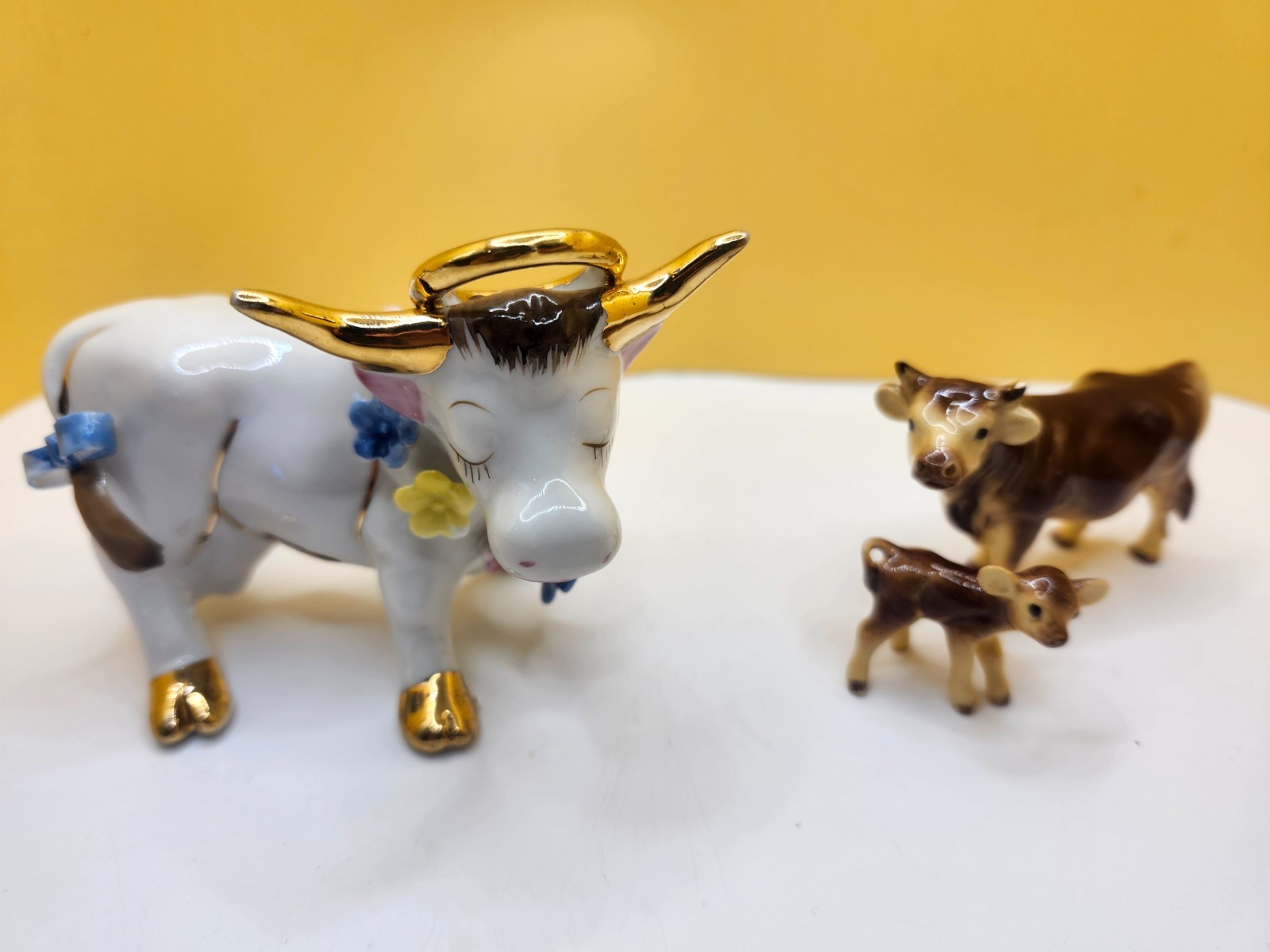 Bull figurine lot featuring vintage bull and calf porcelain with glossy...