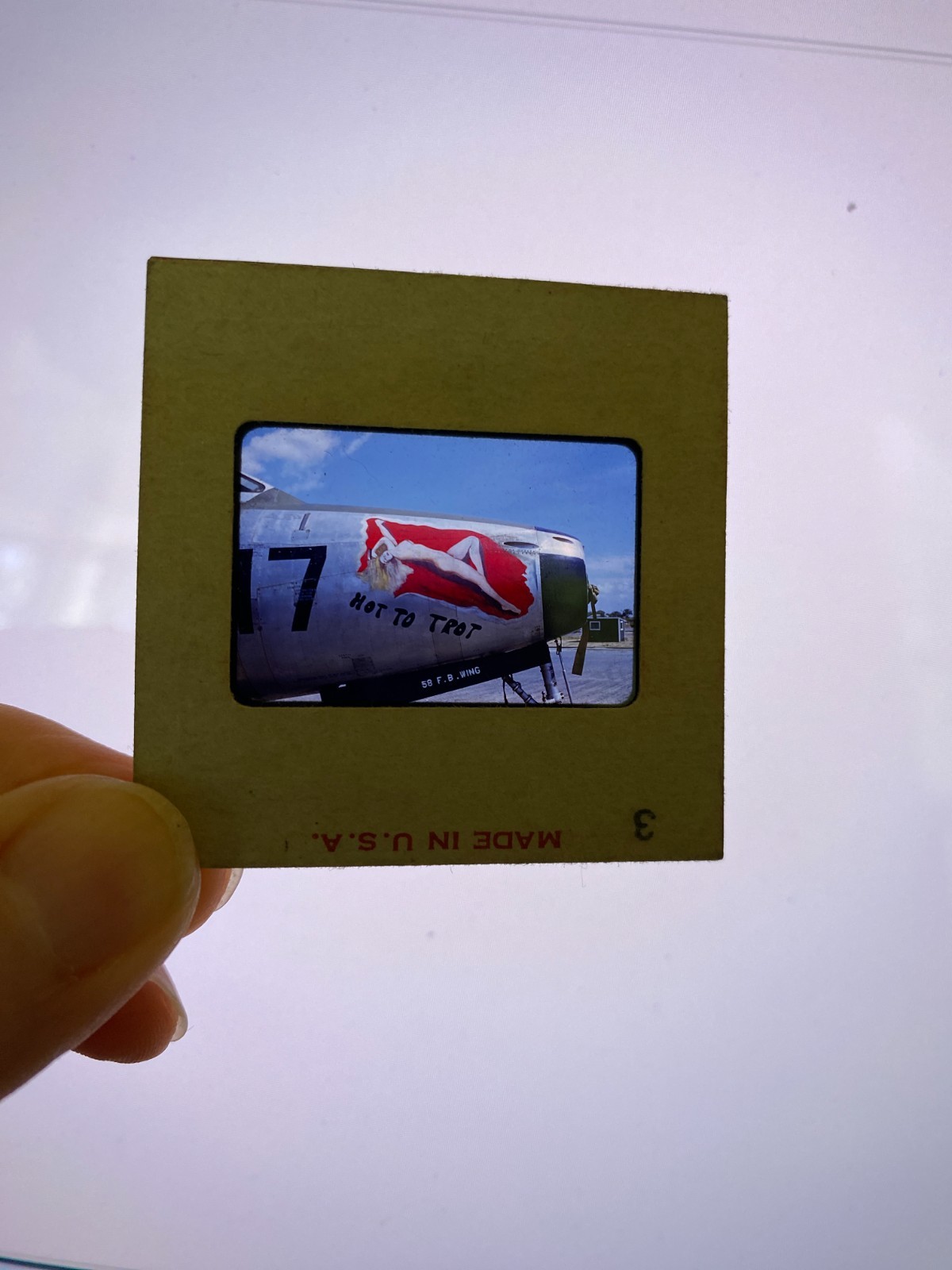 Photo red border 1950s slide Nude Hot to Trot Girl Pin-up on WWII airplane Photo red border 1950s slide Nude Hot to Trot Girl Pin-up on WWII airplane