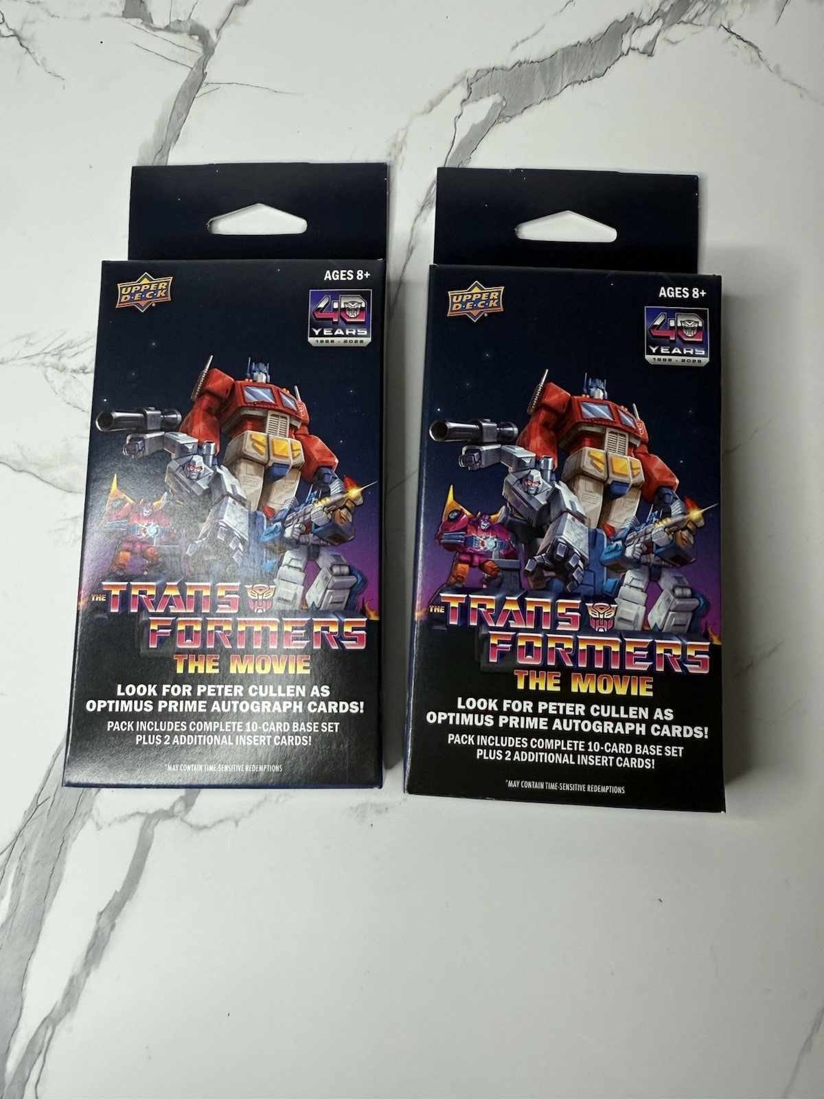 Upper Deck Transformers: The Movie 40th Anniversary 2 Sealed Packs in Hand Upper Deck Transformers: The Movie 40th Anniversary 2 Sealed Packs in Hand