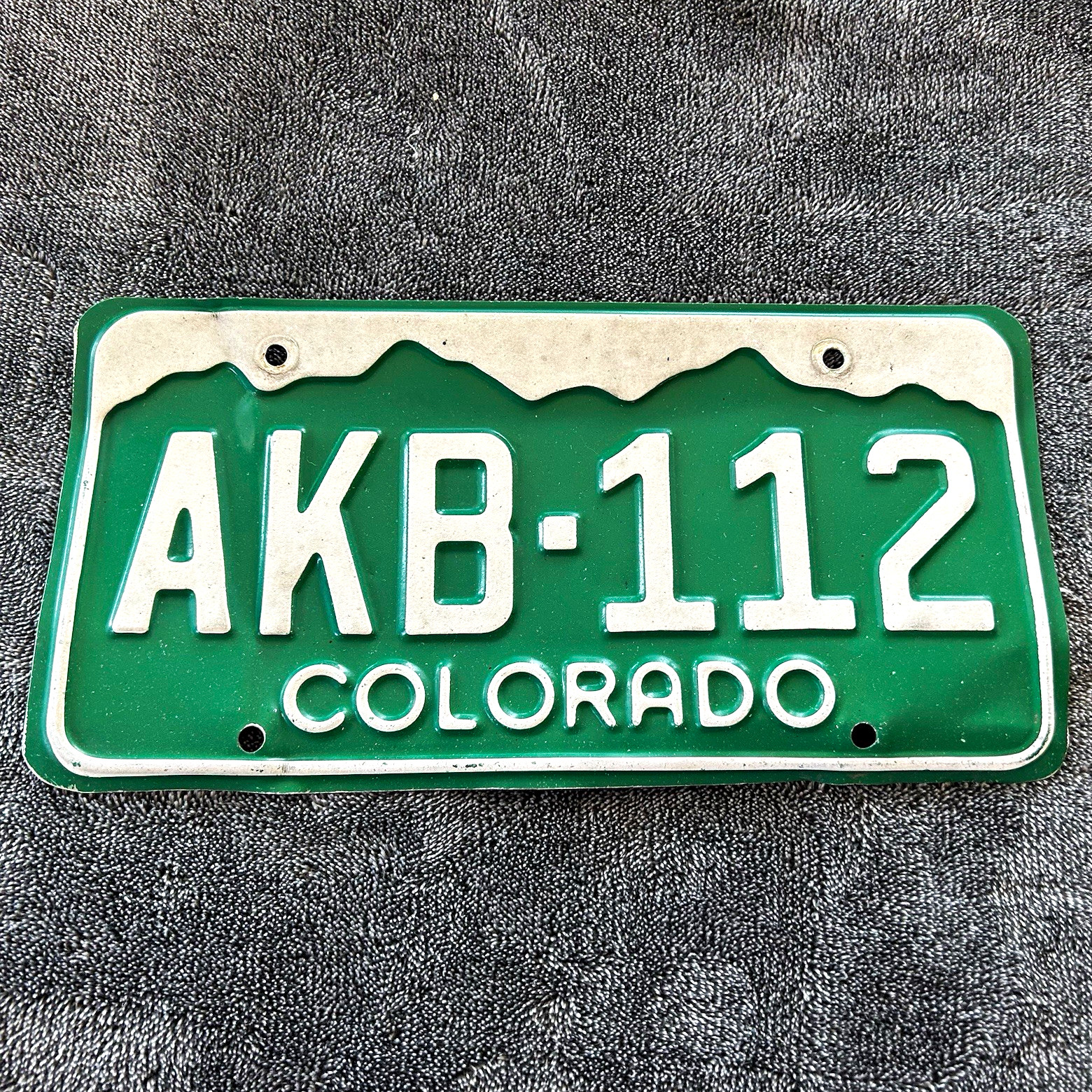 Vtg 1980s Colorado Green & White Embossed License Plate AKB-112