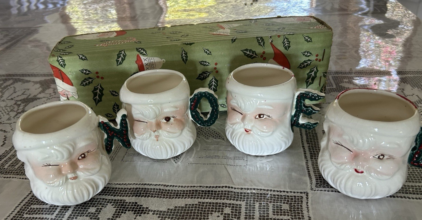 FOUR Vintage 50’s Winking Santa Christmas Mugs: handles spell NOEL Japan 1950's.