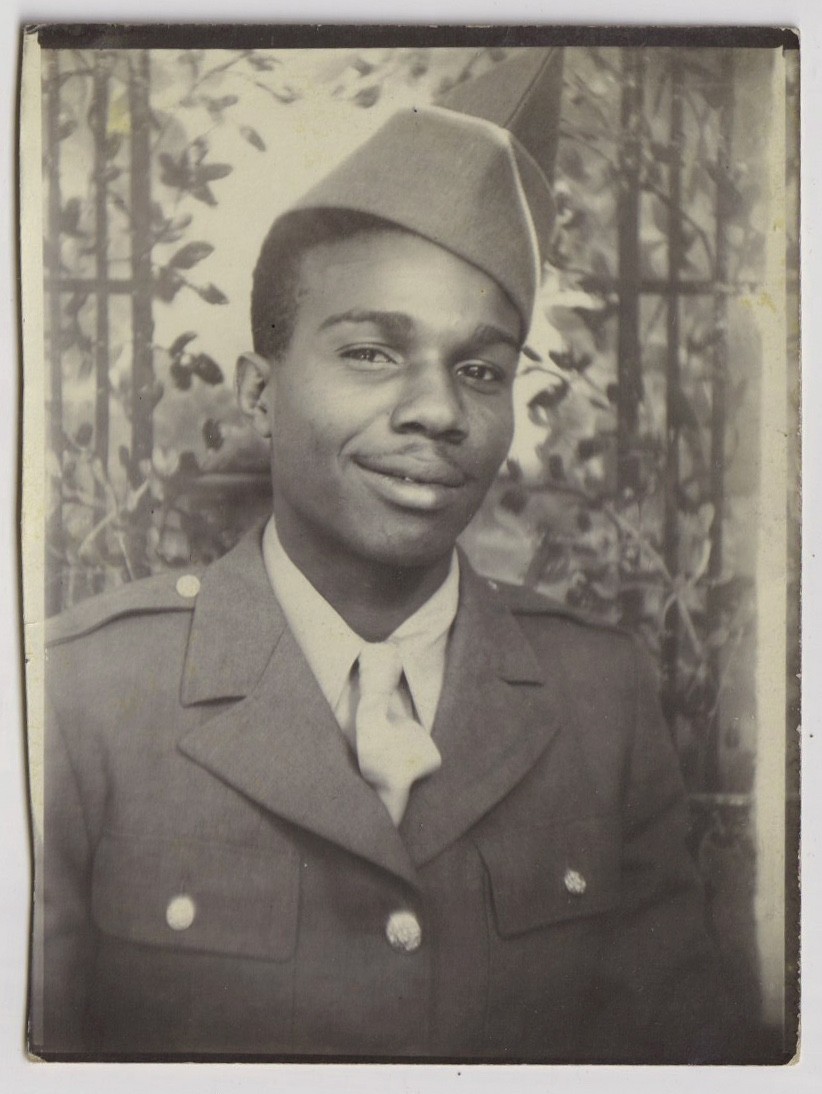 HANDSOME YOUNG African American Soldier smirks in painted BLACK STUDIO photo HANDSOME YOUNG African American Soldier smirks in painted BLACK STUDIO photo