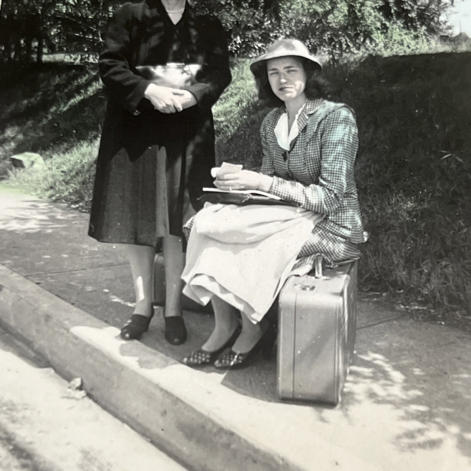 Vintage Snapshot Lady Sitting on Suitcase 1940s Waiting on Ride Sidewalk - U3 Vintage Snapshot Lady Sitting on Suitcase 1940s Waiting on Ride Sidewalk - U3