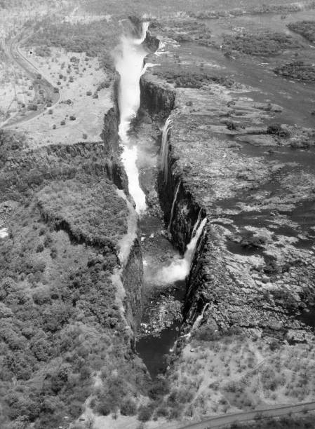 The Victoria Falls borders Zimbabwe Zambia where Zambesi river plu- Old Photo
