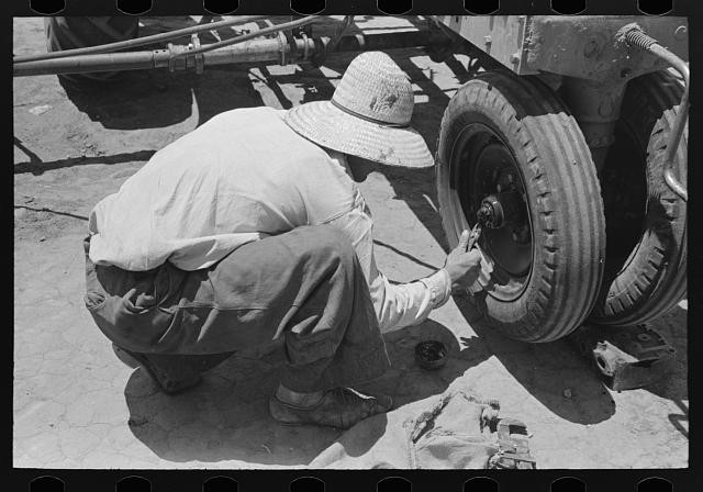 Photo:Ralls Texas 1939 Day Laborer Putting Cotter Pin by Tractor FSA Farm