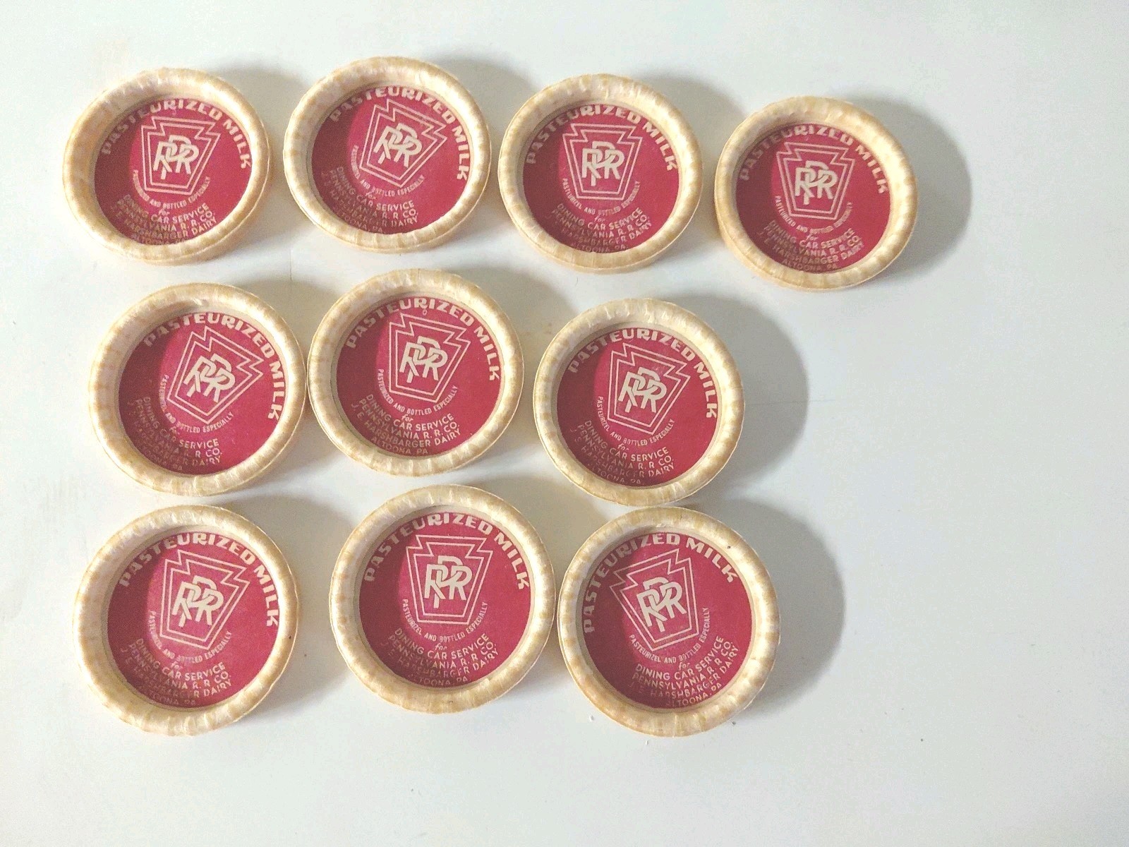 10 NOS Vtg Milk Bottle Carton Cap Pennsy Railroad PRR Harshbarger Altoona Pa