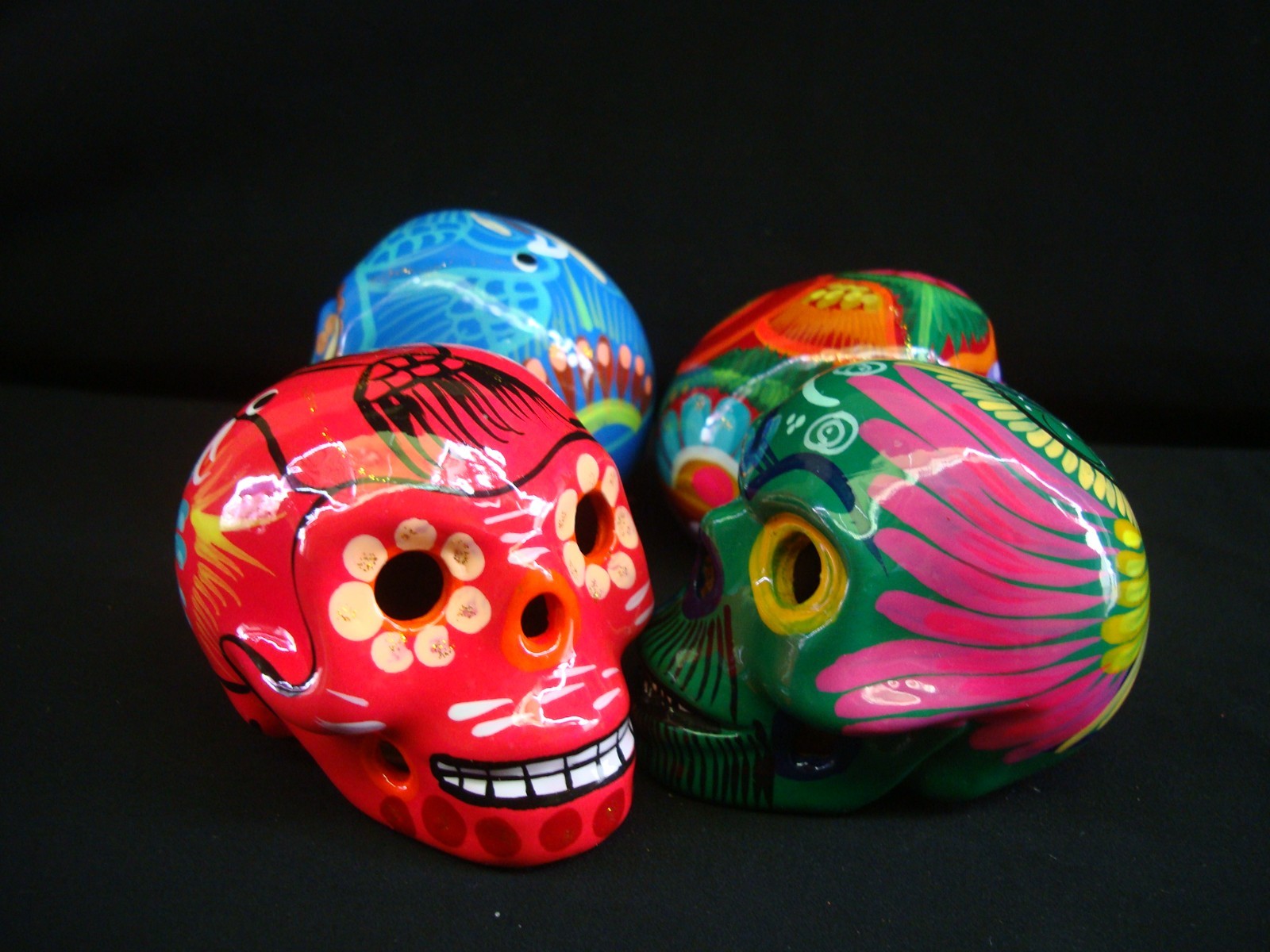 Lot of 4 Day of the Dead Sugar Skulls made of clay and hand painted