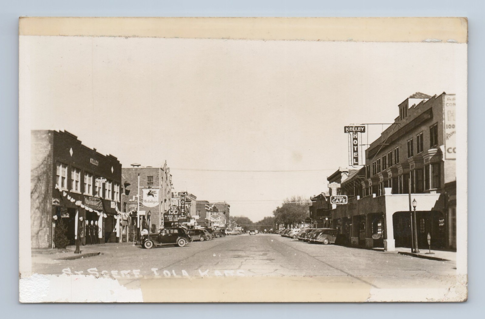c1940 S Washington Street View Iola KS RPPC Kelley Hotel Mobilgas Oldsmobile VTG