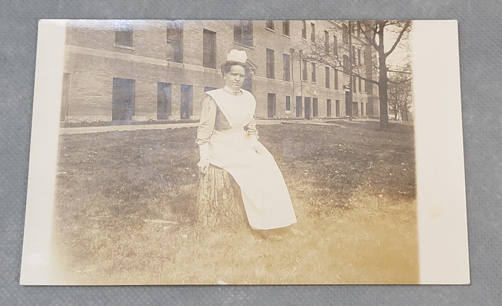 Vintage RPPC Real Photo NURSE SITTING OUTSIDE Unused POSTCARD