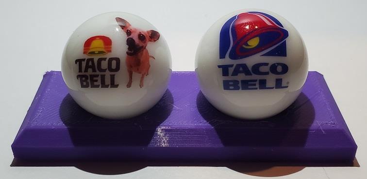 1 Super Nice Set of 2 Taco Bell Glass Marbles with Stand