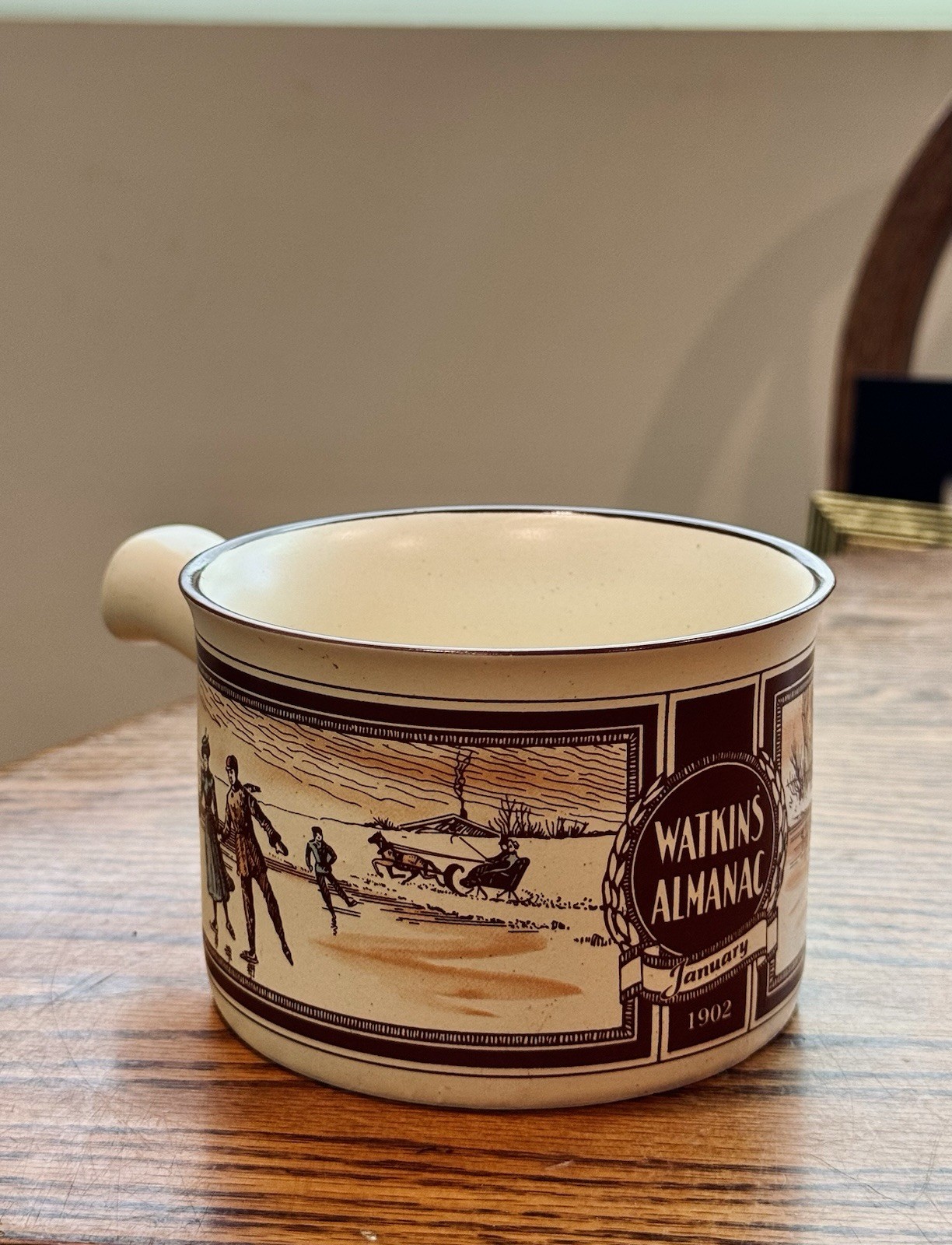 1986 Watkins Almanac stoneware handled soup mug W/ illustration January 1902
