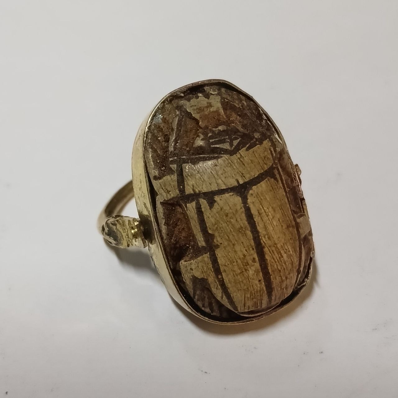Egyptian scarab ring, antique style, hand‑carved stone with hieroglyphic motifs Egyptian scarab ring, antique style, hand‑carved stone with hieroglyphic motifs