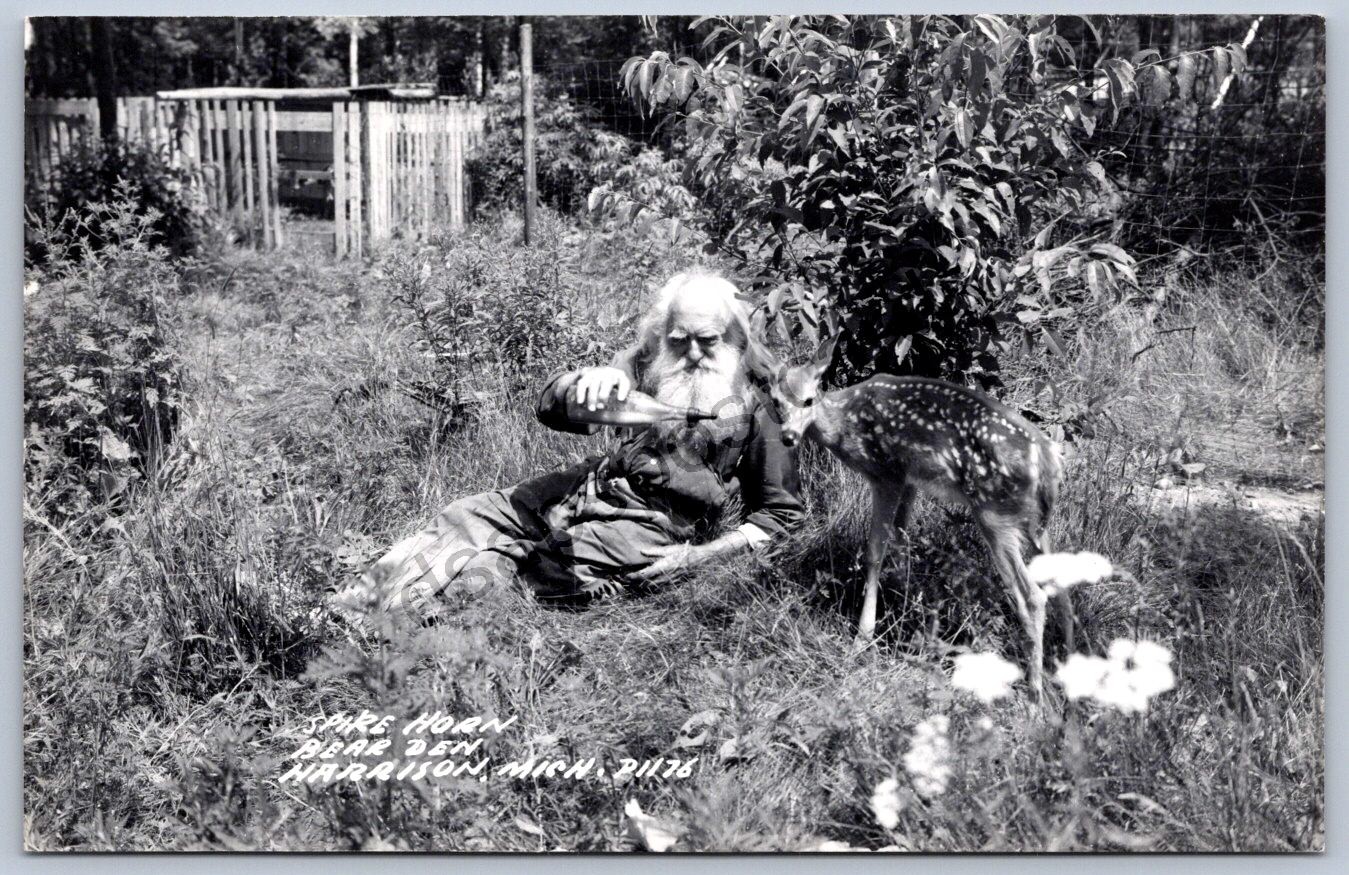K66/ Harrison Michigan RPPC Postcard c40-50s Spikehorn bear Den Man 210