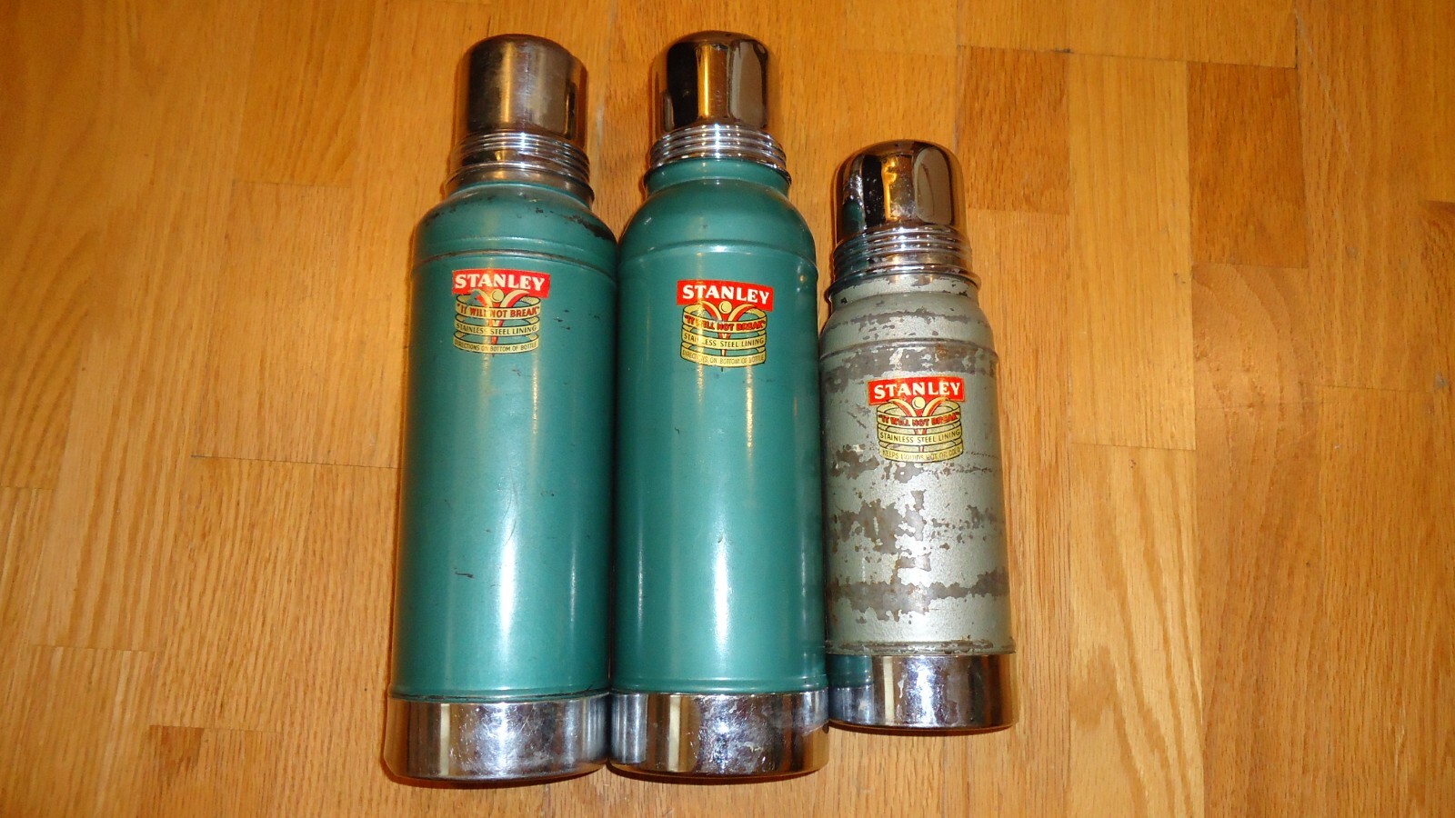 Vintage Stanley Thermos x 3. Vintage Stanley Thermos x 3.