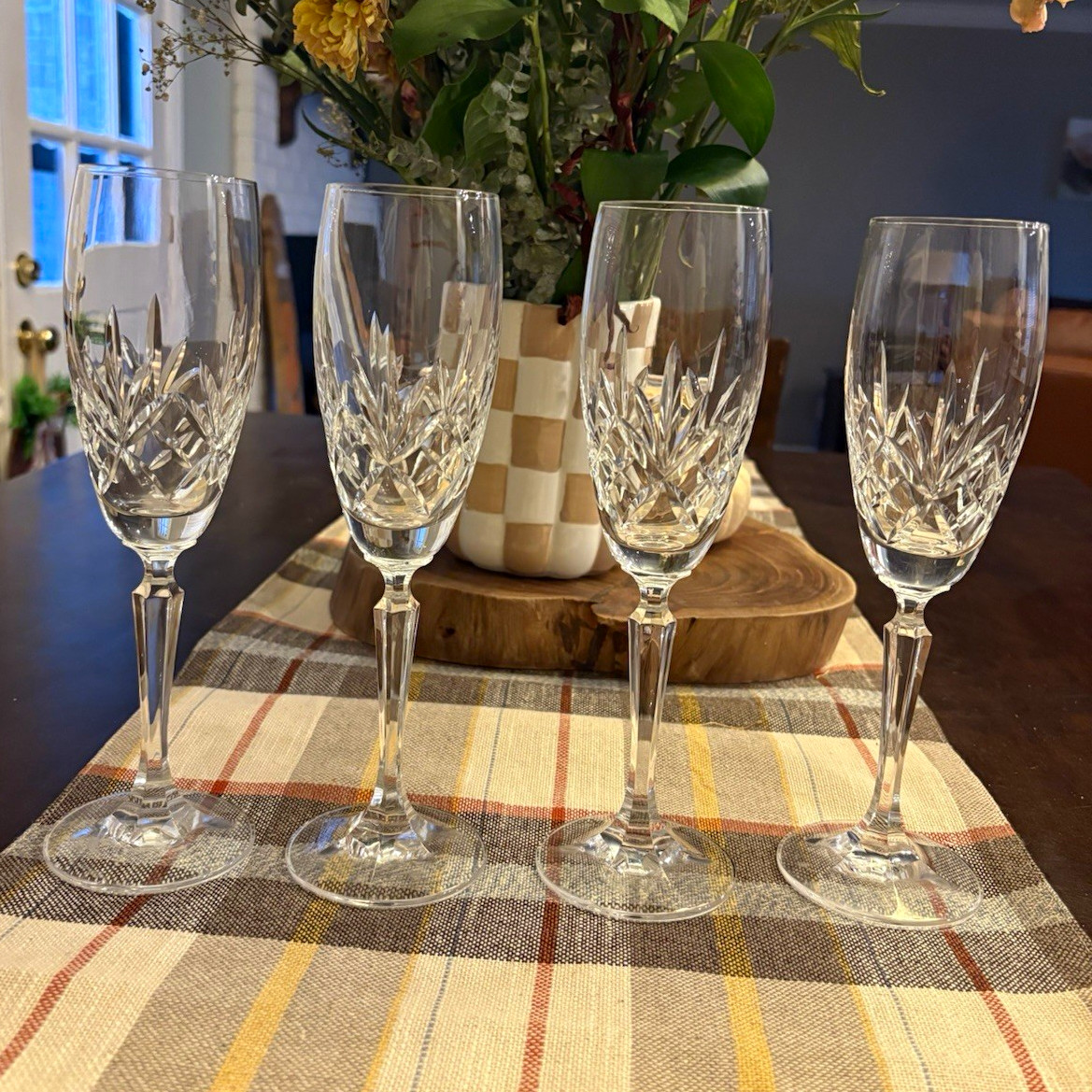 A set of 4 vintage Marquis by Waterford Brookside 9-inch champagne flutes.