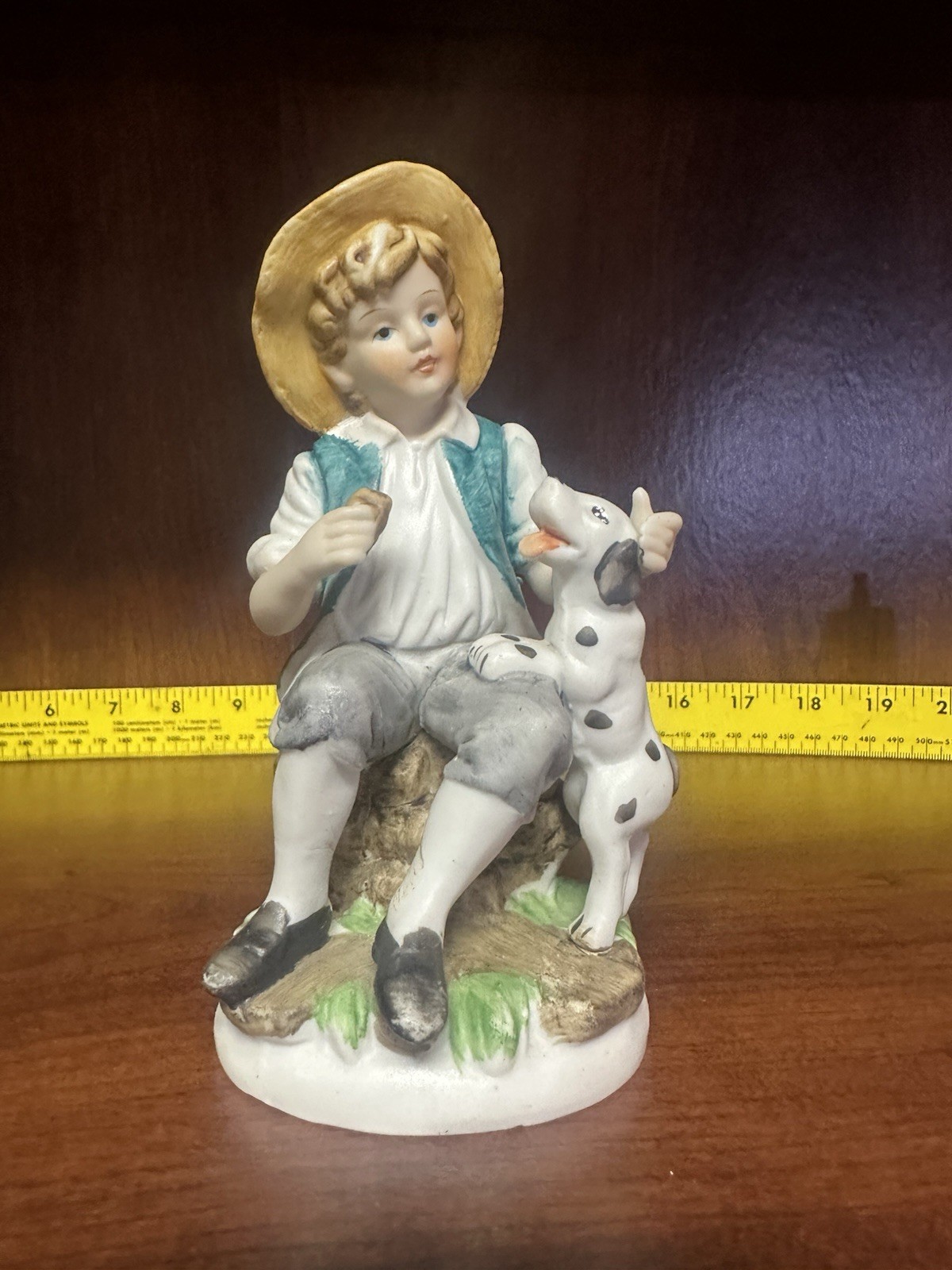 vintage porcelain boy with dog figurine