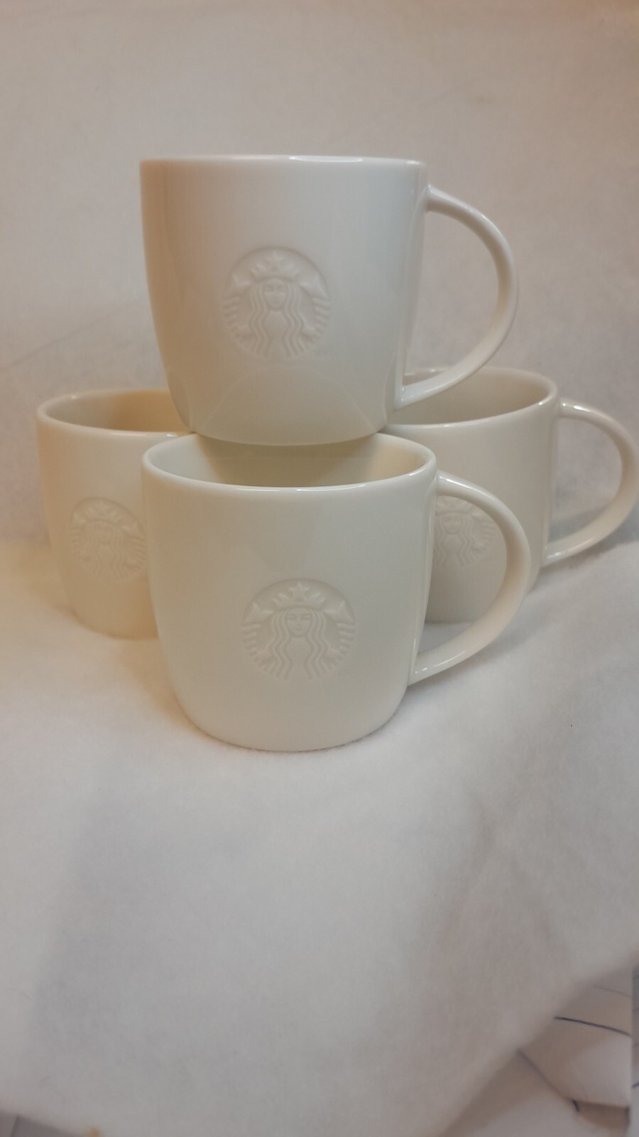 STARBUCKS 2010 Coffee Mug White Siren Mermaid Logo Embossed S STARBUCKS 2010 Coffee Mug White Siren Mermaid Logo Embossed S