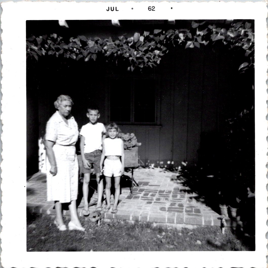 Grandmother with Grandchildren on Patio, 1962 B&W Vintage Snapshot Photo