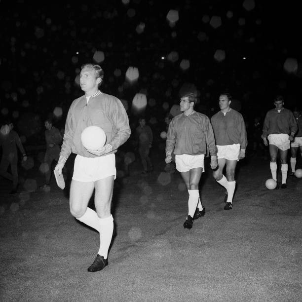 England captain Bobby Moore followed out onto the pitch team mate 1964 Photo