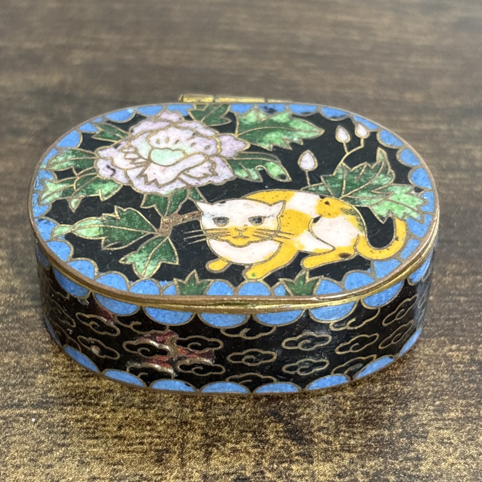 VTG Cloisonné Pill Box Calico Orange Cat W/ Flowers Blue Enamel Base 1.75” VTG Cloisonné Pill Box Calico Orange Cat W/ Flowers Blue Enamel Base 1.75”