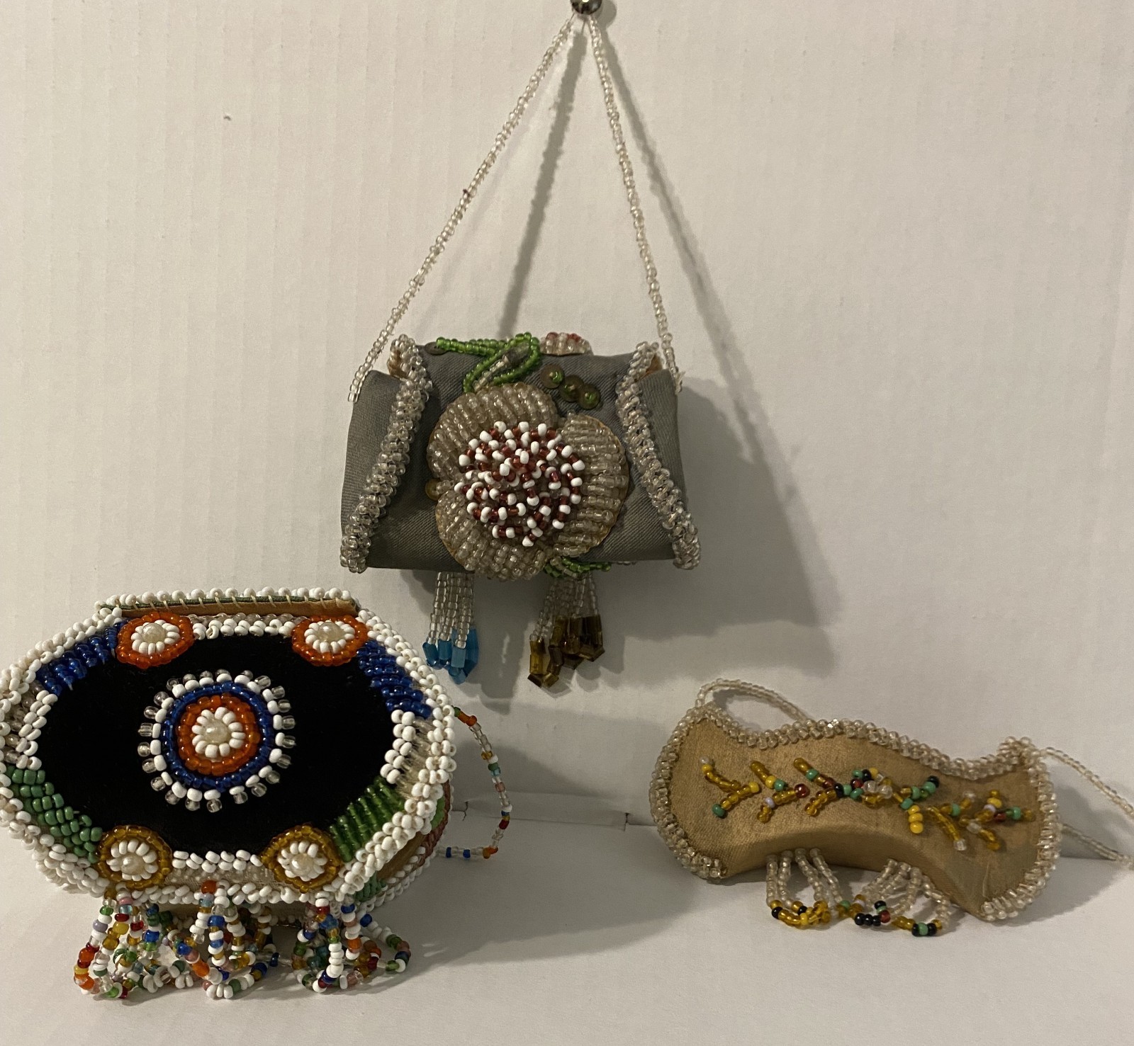 Antique Native American Iroquois souvenir beadwork of two small boxes and canoe Antique Native American Iroquois souvenir beadwork of two small boxes and canoe