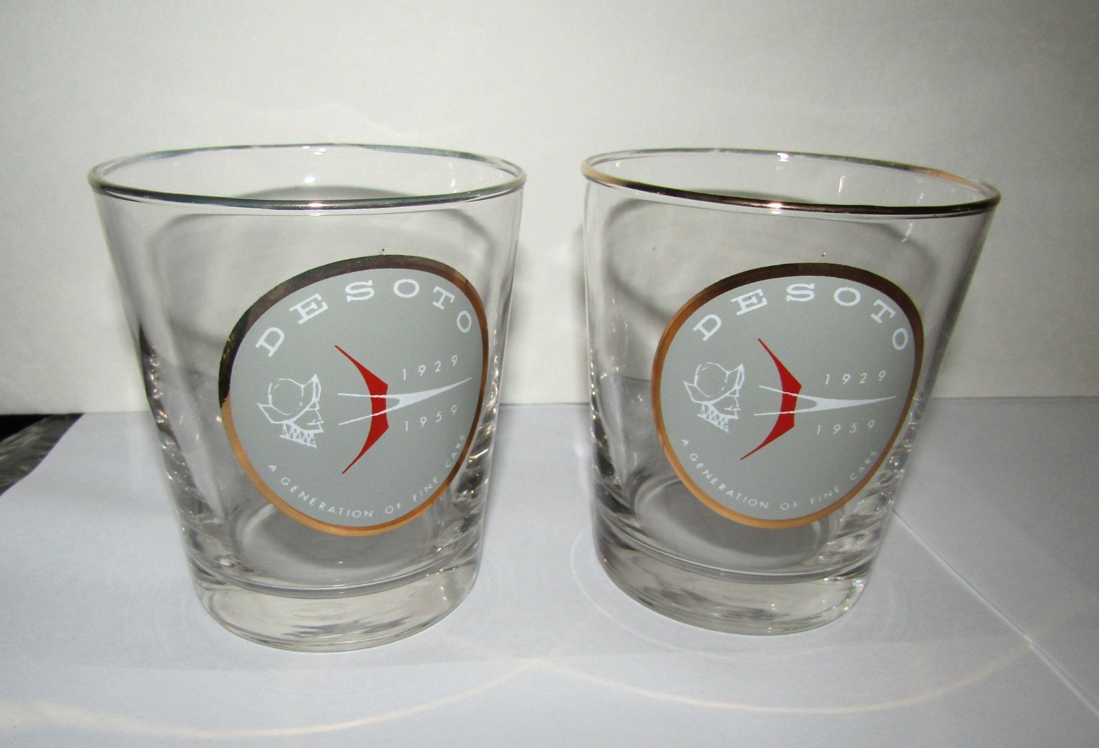 TWO COLLECTIBLE VINTAGE NEW PLYMOUTH DESOTO DEALER PROMO ON THE ROCKS GLASSES