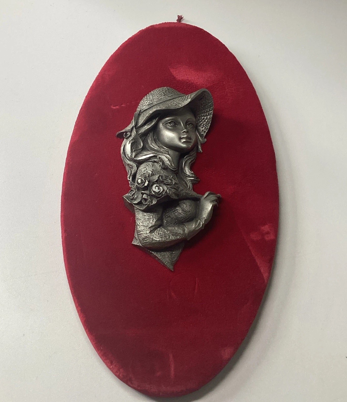 Vintage French Wall Decor Of Pewter Lady w/hat Against Red Velvet Back ground Vintage French Wall Decor Of Pewter Lady w/hat Against Red Velvet Back ground
