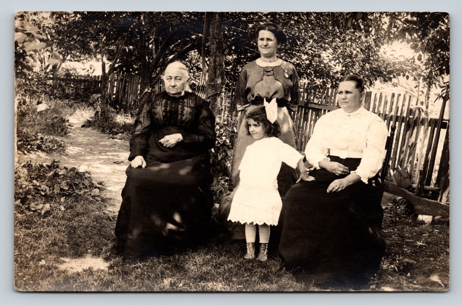 RPPC Women & Child Fenced Yard Serious Granny CLASSIC Fashion VINTAGE Postcard