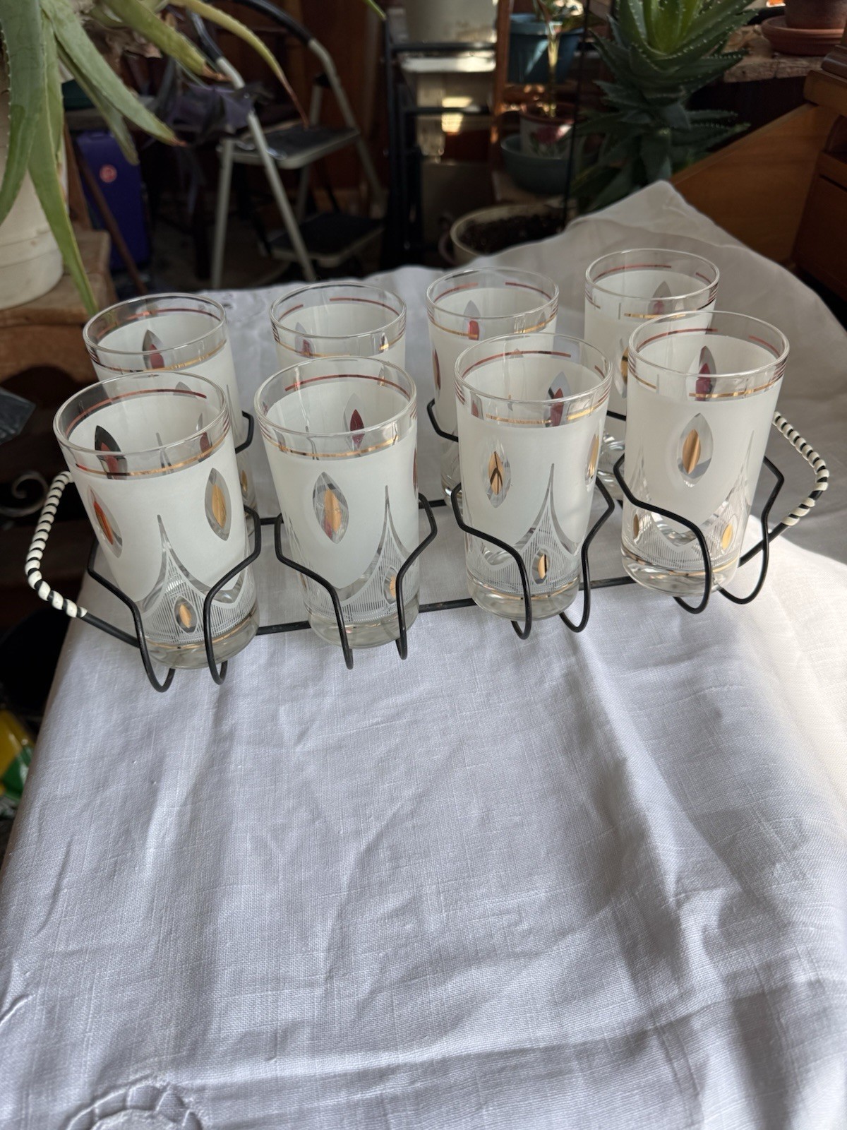 A Set Of Vintage Glasses And Holder