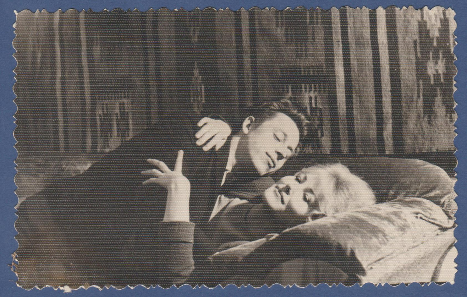 Beautiful guy and girl lying in bed, couple in love. Soviet Vintage Photo USSR