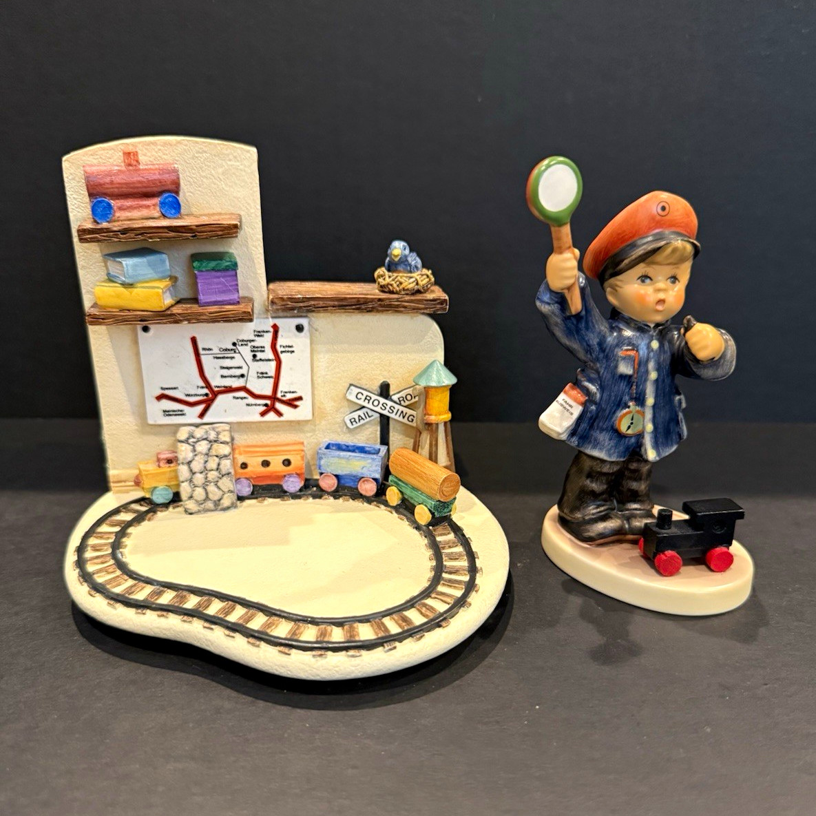 Goebel M.I. Hummel 'All Aboard' Figurine 2044 with 'Homeward Bound' 1044-D Set Goebel M.I. Hummel 'All Aboard' Figurine 2044 with 'Homeward Bound' 1044-D Set