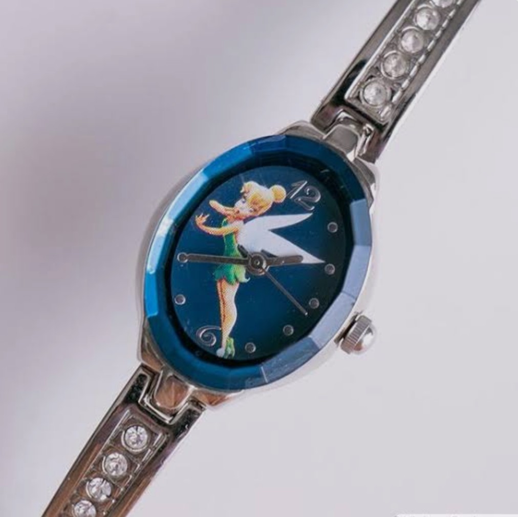a silver-tone Disney Tinker Bell watch featuring a blue dial, 