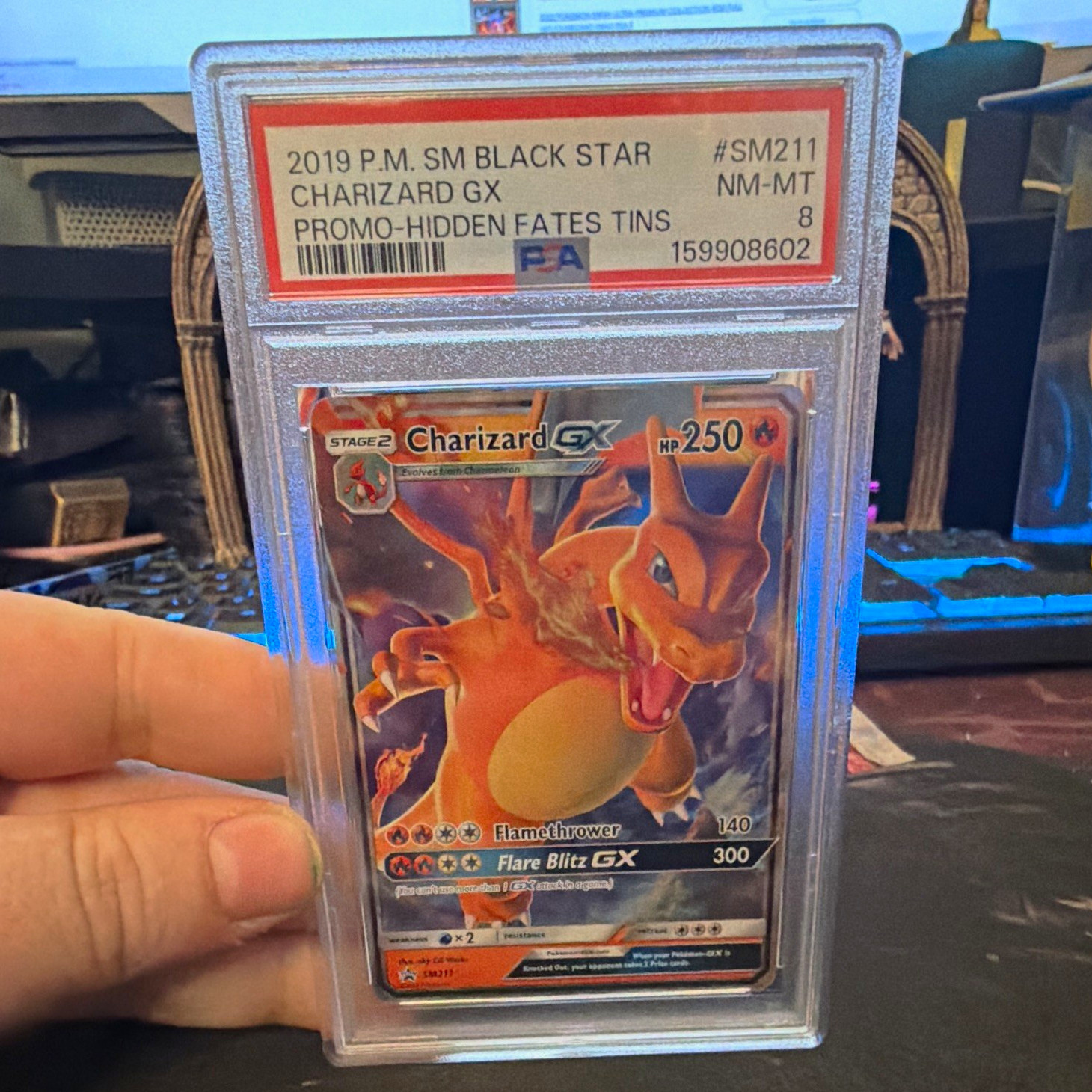 The Pokémon Company 2019 SM Promo Charizard GX SM211 ENG Holo PSA 8